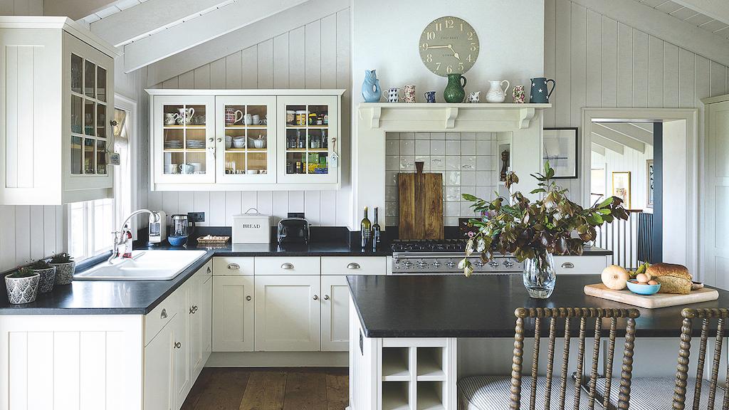 Use glass-front cabinets to display pretty dishes and keep your eat-in kitchen light