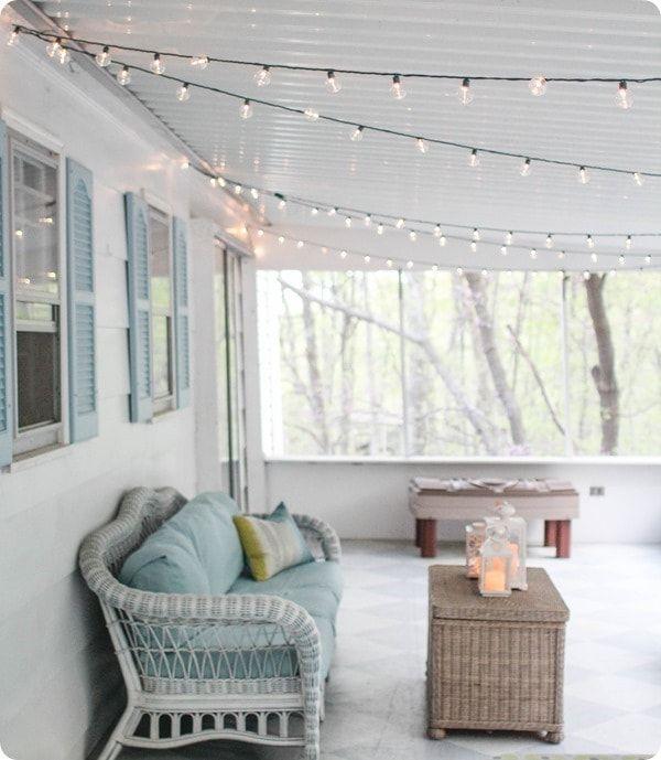 Add twinkling string lights to your screened ​porch for enchanting evening ambiance