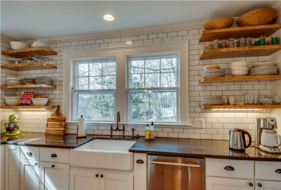 Well-placed windows invite natural light into your farmhouse kitchen