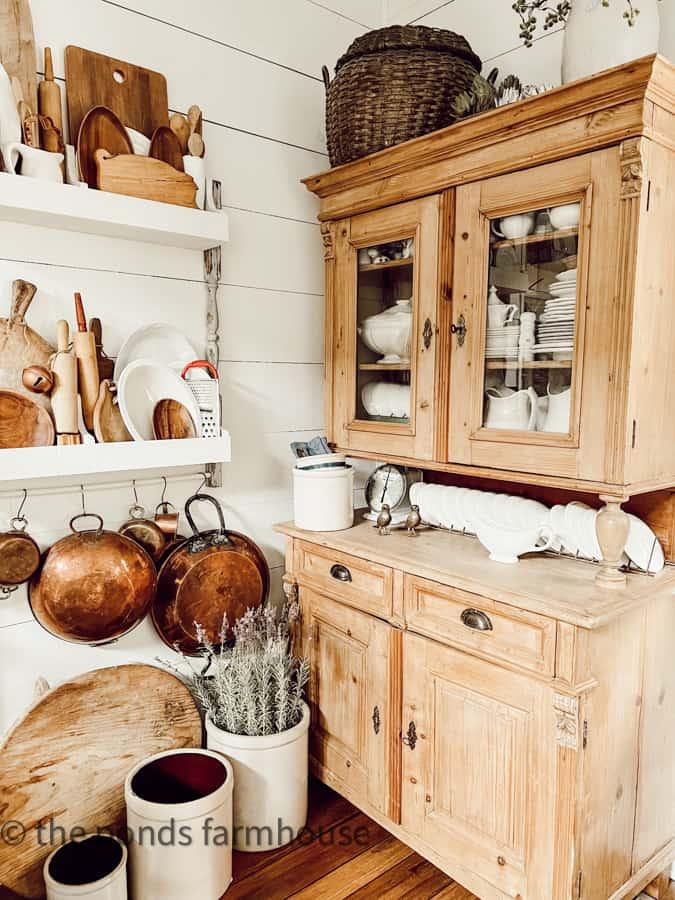 An antique hutch showcases your collection in the farmhouse kitchen