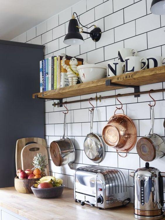 Utilize vertical space with wall-mounted shelves in your galley kitchen for extra storage