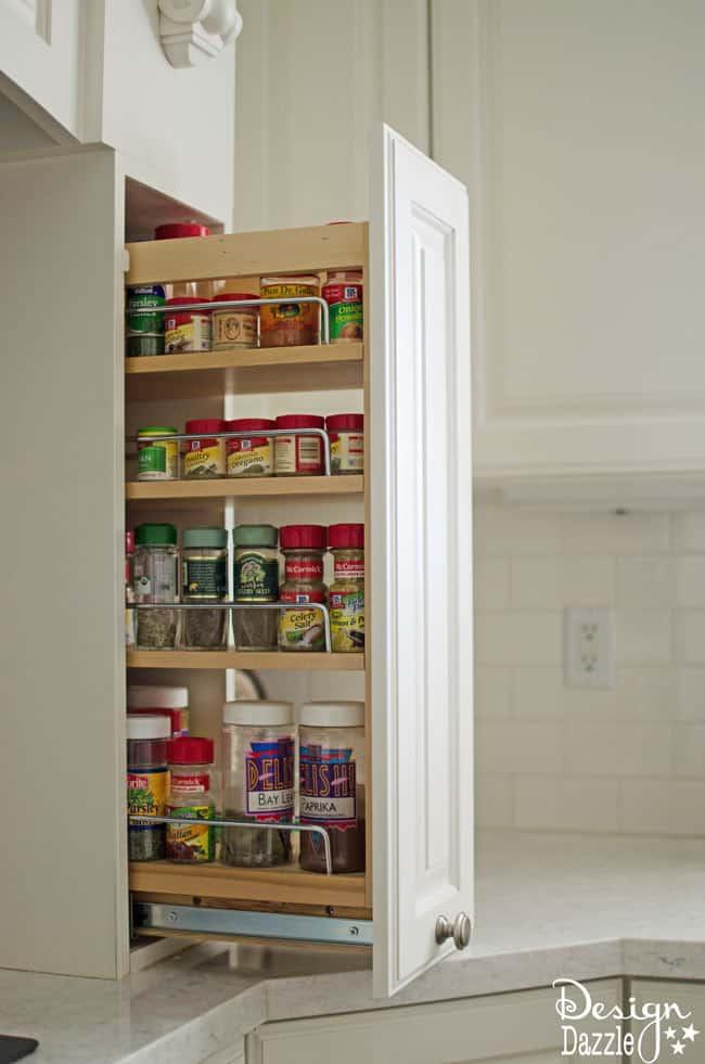 Create hidden storage solutions for a clutter-free and organized kitchen environment