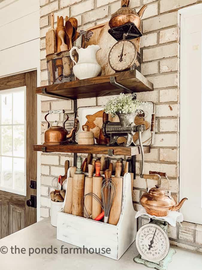 Vintage rolling pins hang on the wall for a touch of nostalgia in your kitchen