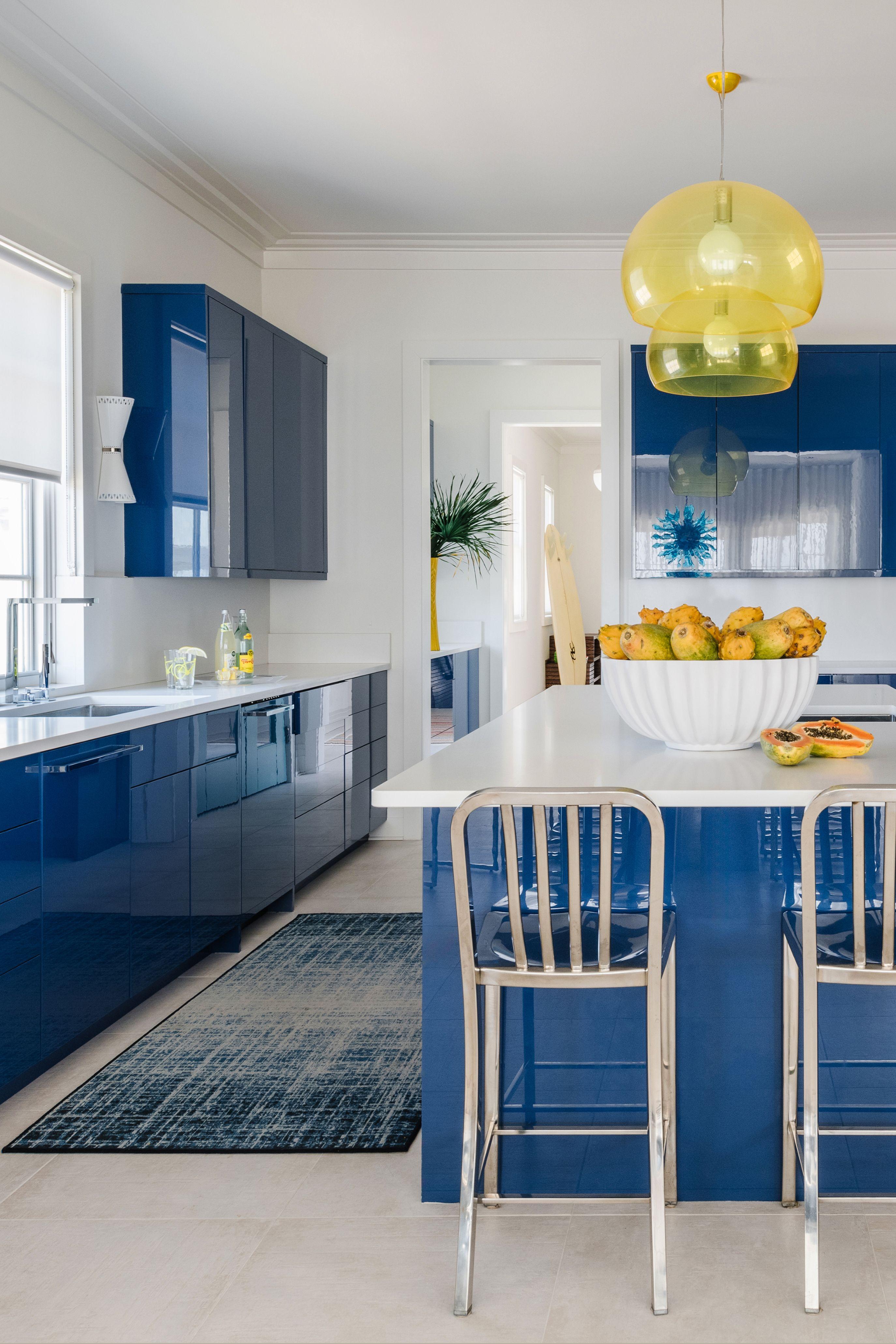 Use neutral palettes paired with daring accents for a balanced yet vibrant kitchen look