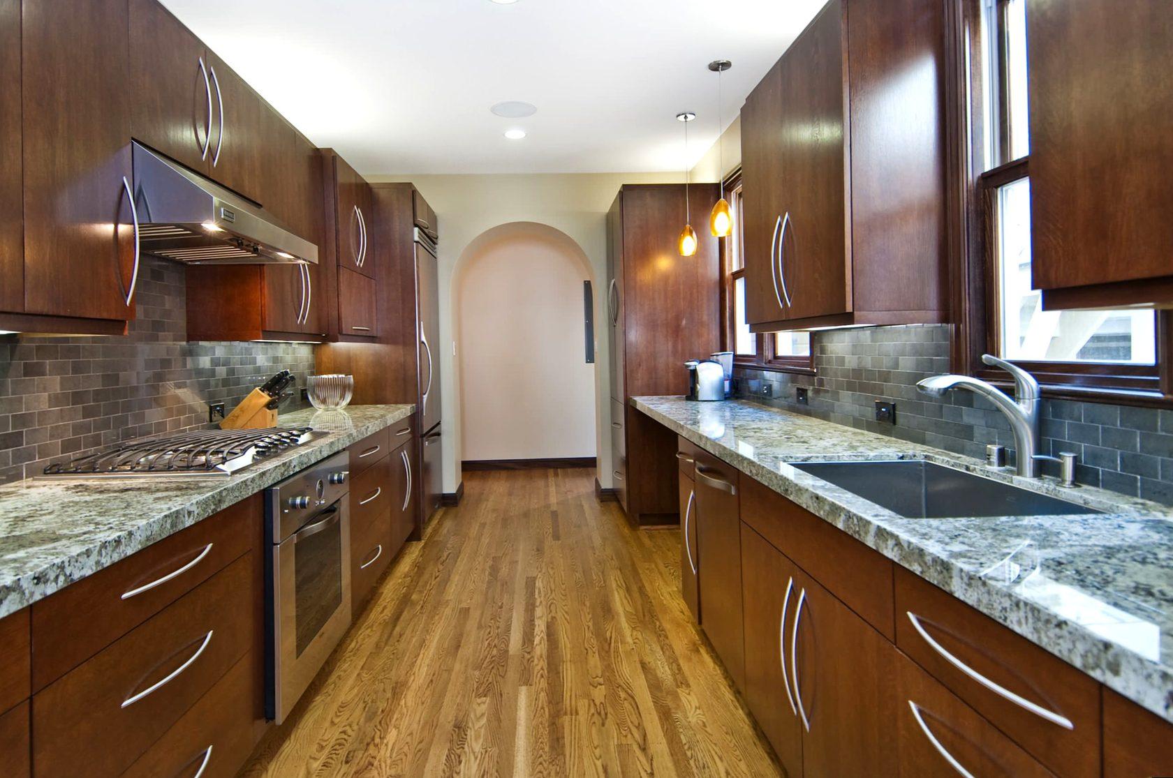 Install a drop-leaf countertop to expand surface area in your ‌galley kitchen