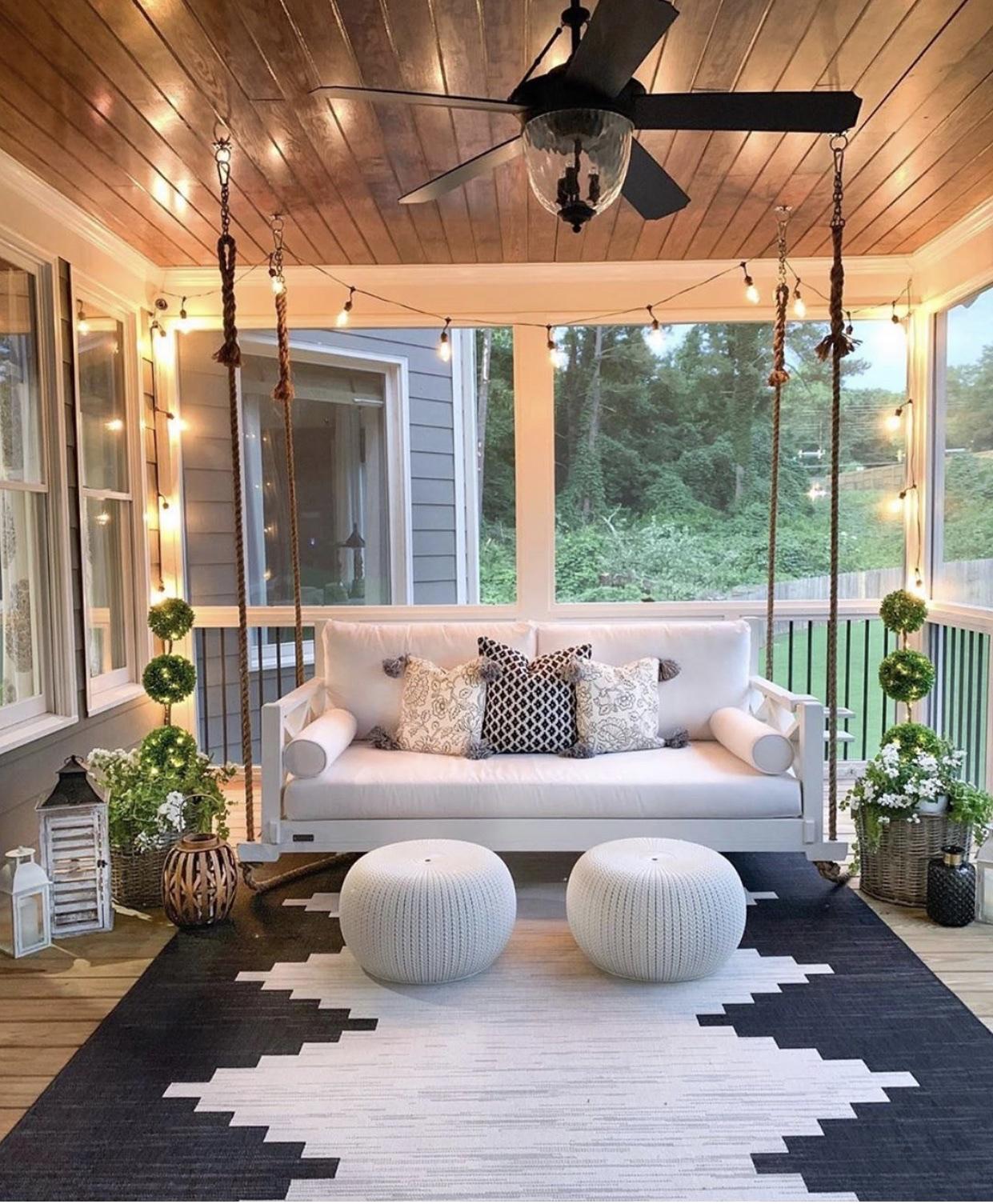 Hang fairy lights to add a warm ambiance to your screened porch