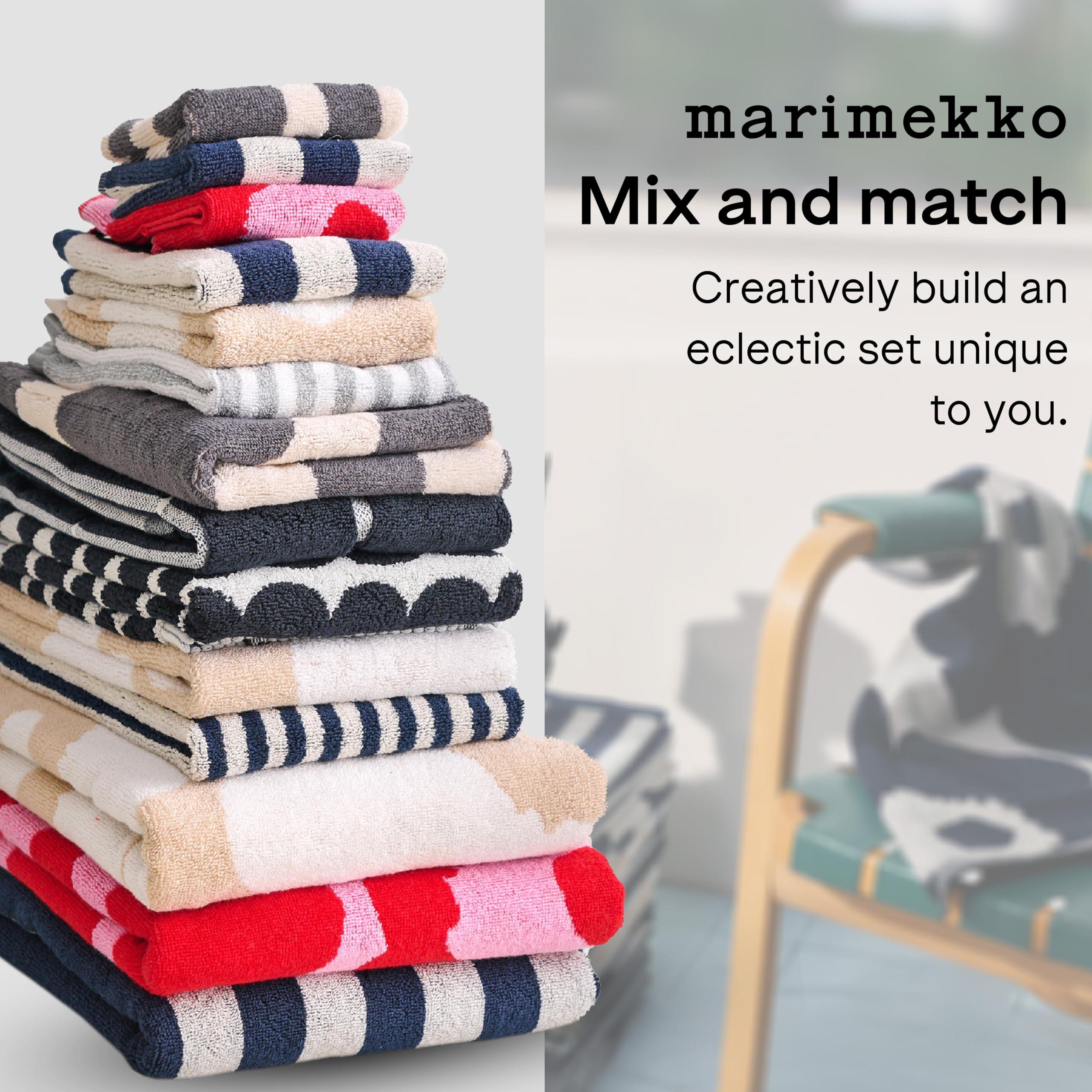 Mix and match towels for playful textiles in your eclectic bathroom