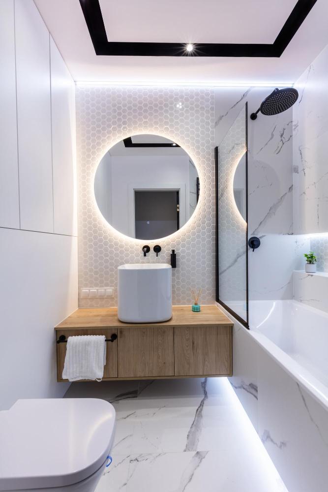 Add mirrors to create ⁤an⁤ illusion of space ​in small bathroom