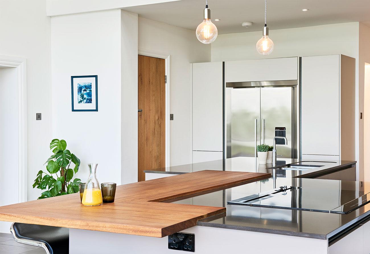 Incorporate mixed materials for a dynamic look in your kitchens surfaces