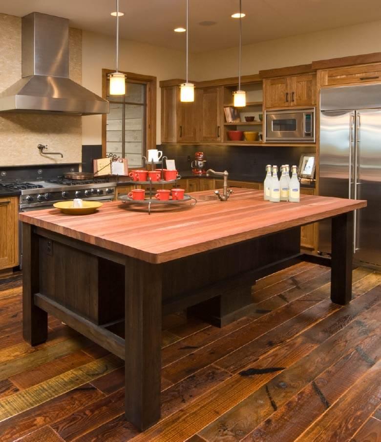 Farmhouse kitchen island offering additional prep space and communal gathering