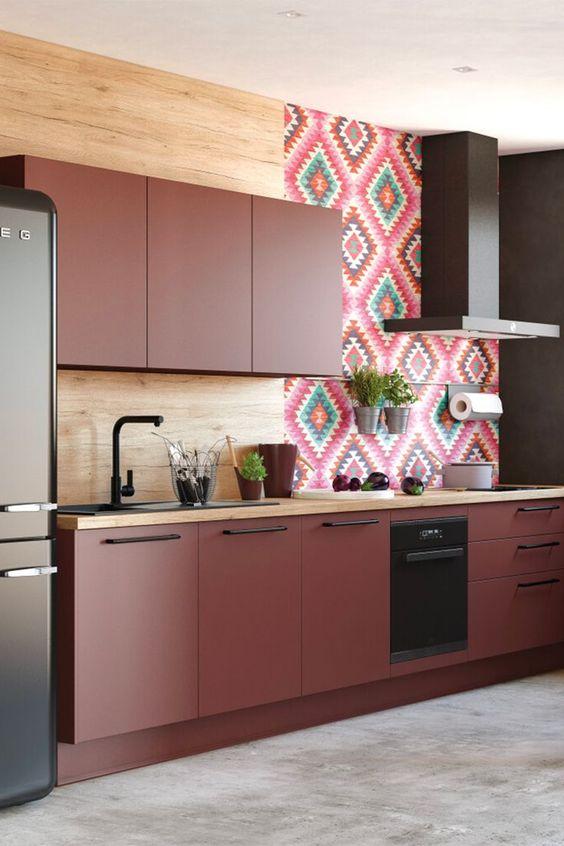 Select ​a bold backsplash to showcase the rich burgundy shades in your kitchen