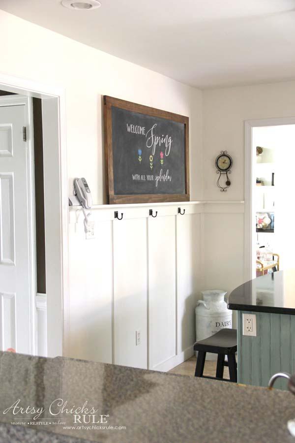 A chalkboard wall in your farmhouse kitchen adds a personal touch and organization