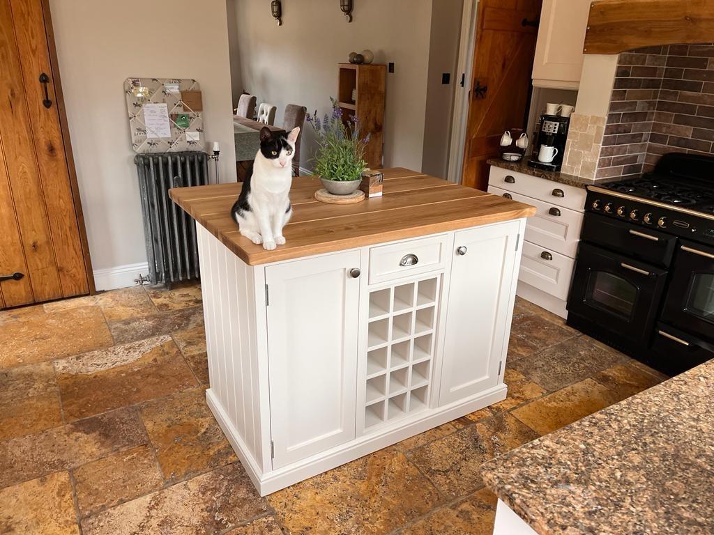 A spacious island for meal prep and gathering in your farmhouse kitchen