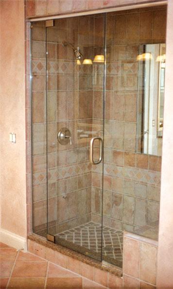 Install a glass shower door ​for a more open feel in narrow bathrooms