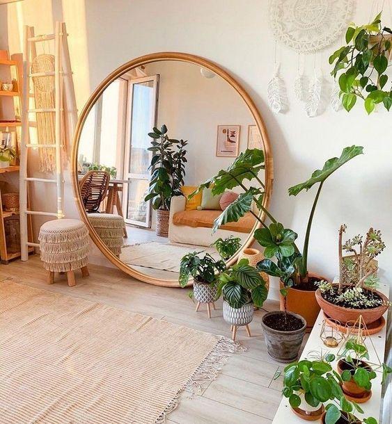 Incorporate an oversized ⁢mirror to reflect light and create depth in​ your Boho living room