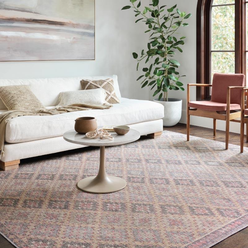 Layer rugs to define areas within your living room