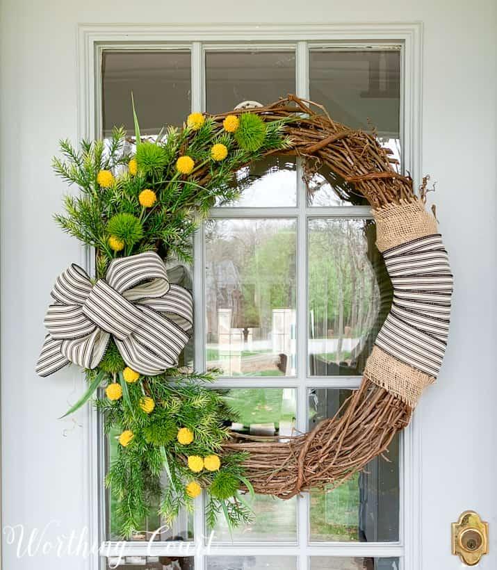 Decorate with seasonal wreaths for charm on your screened porch