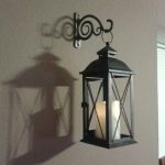 Cheap wall decor idea. Indoor/outdoor lantern with bracket used .