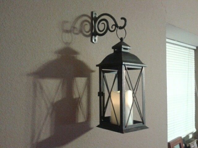 Cheap wall decor idea. Indoor/outdoor lantern with bracket used .