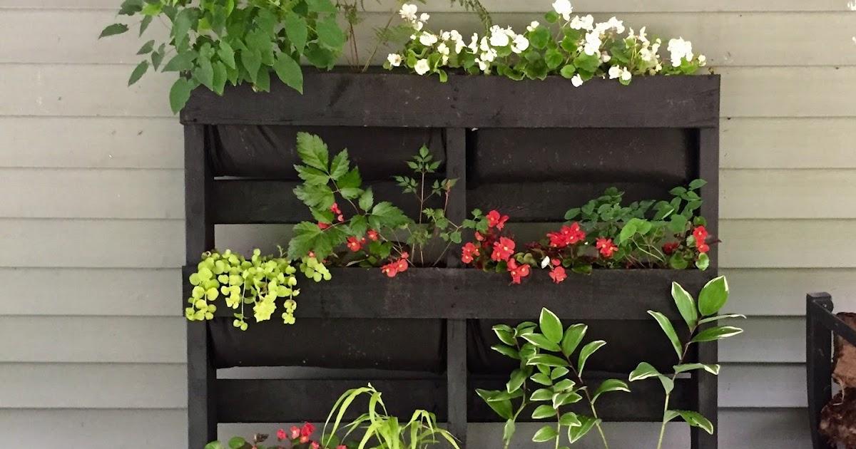 Go vertical by stacking pallets for a unique and space-saving Pallet Garden