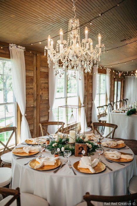 Rustic glam wedding decor - Gold table settings + greenery .