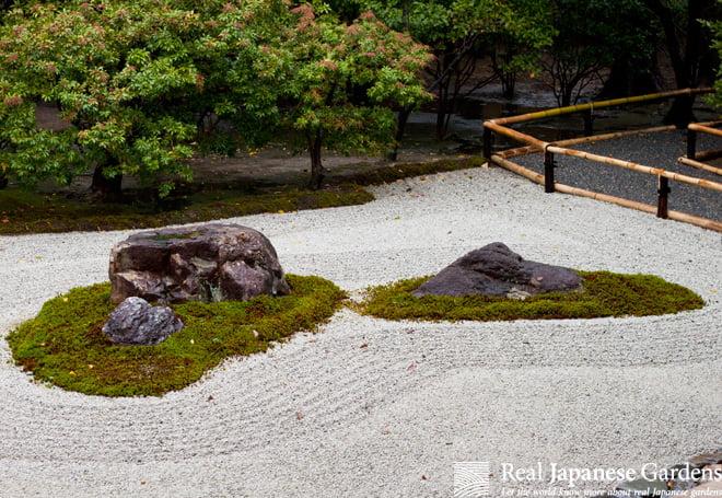 Arrange stones in meaningful patterns for intentional design in your Zen Garden