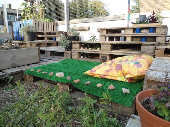 An educational pallet garden can excite kids about nature and responsibility