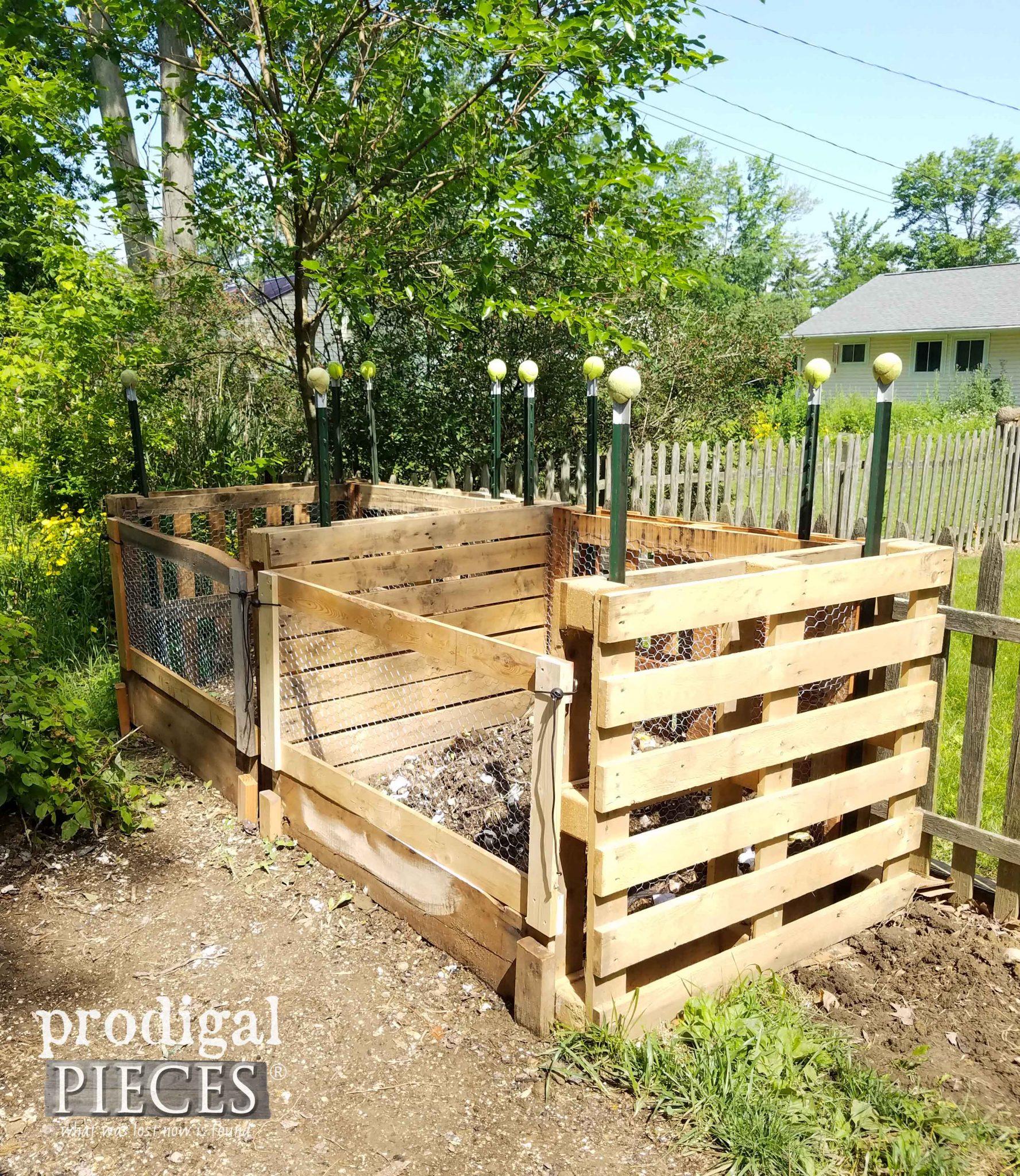 Create a whimsical pallet ​garden compost bin that blends functionality with charm