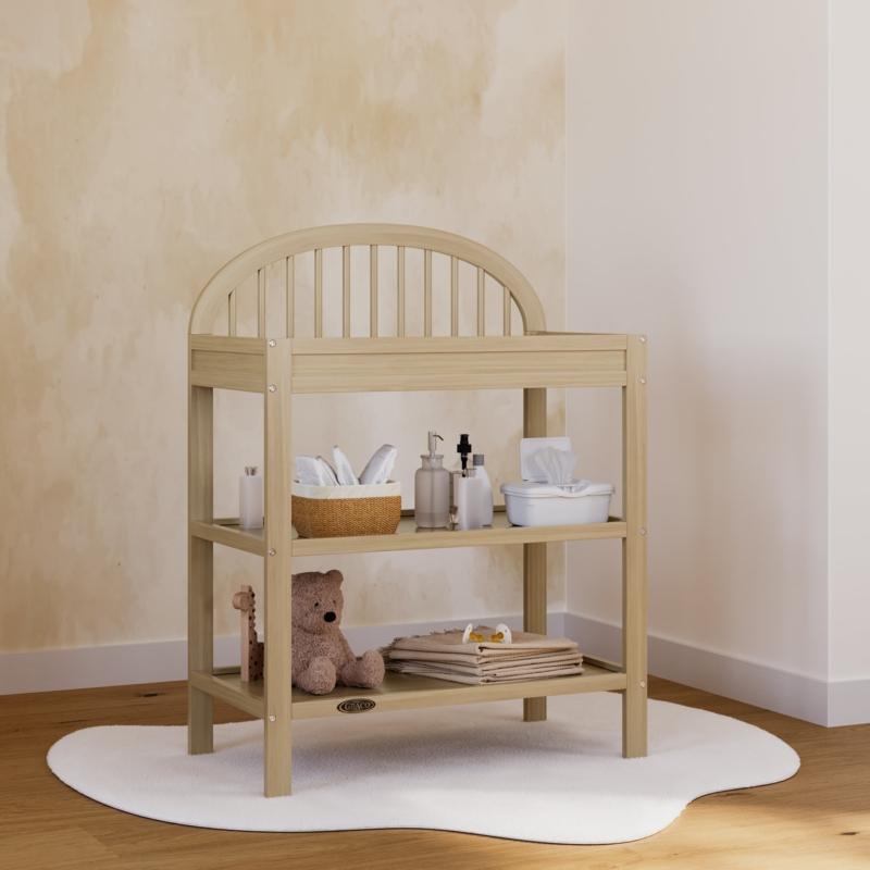 Utilize a changing table with ample storage in your Nursery Nook