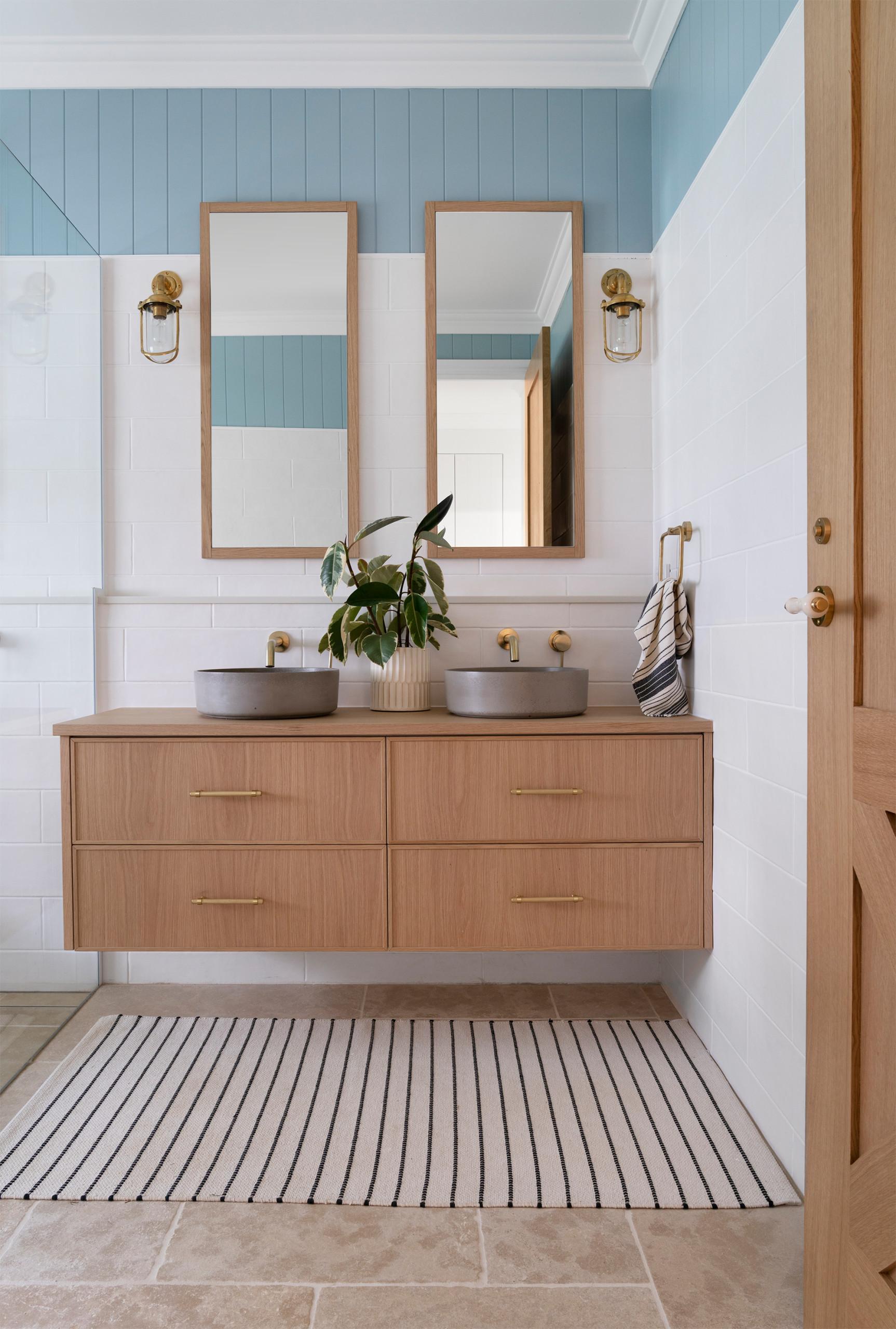 Experiment with interesting hardware on cabinets for eclectic bathroom style