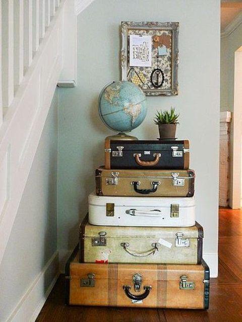 Incorporate vintage suitcases for storage and a whimsical touch in your eclectic living room