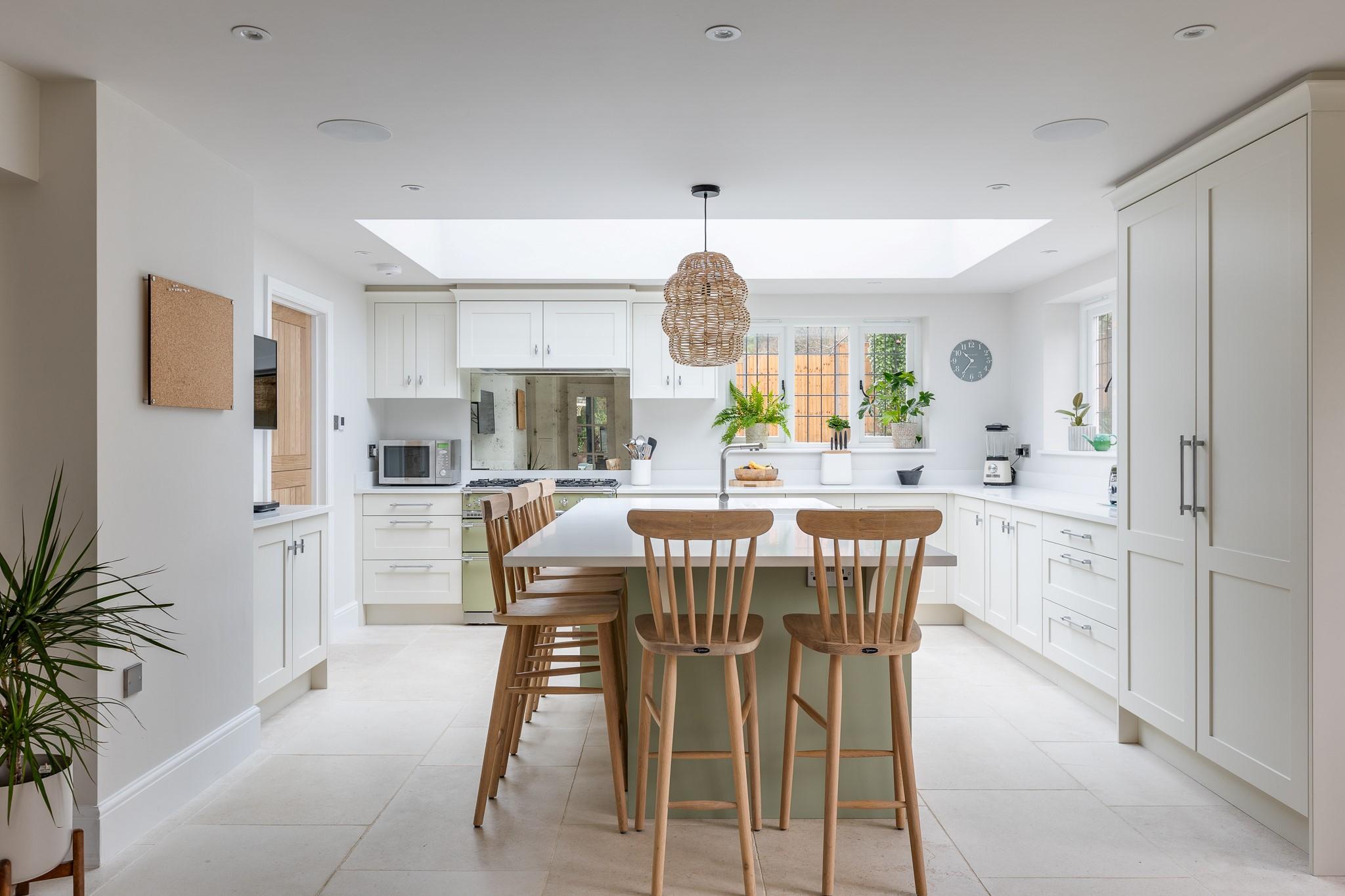 Use mirrors to create an illusion of space in your eat-in kitchen