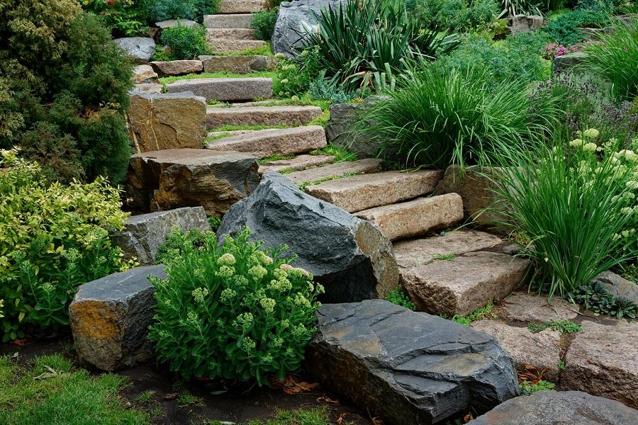 Introduce⁢ decorative boulders for a captivating‍ focal point in ​front yard landscaping