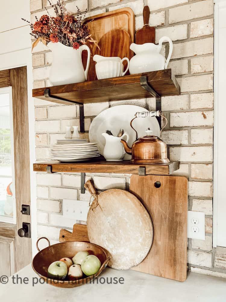 Open shelving to showcase vintage dishware in your farmhouse kitchen