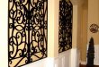 Inset wall niche - wrought iron in square niche with curved top .