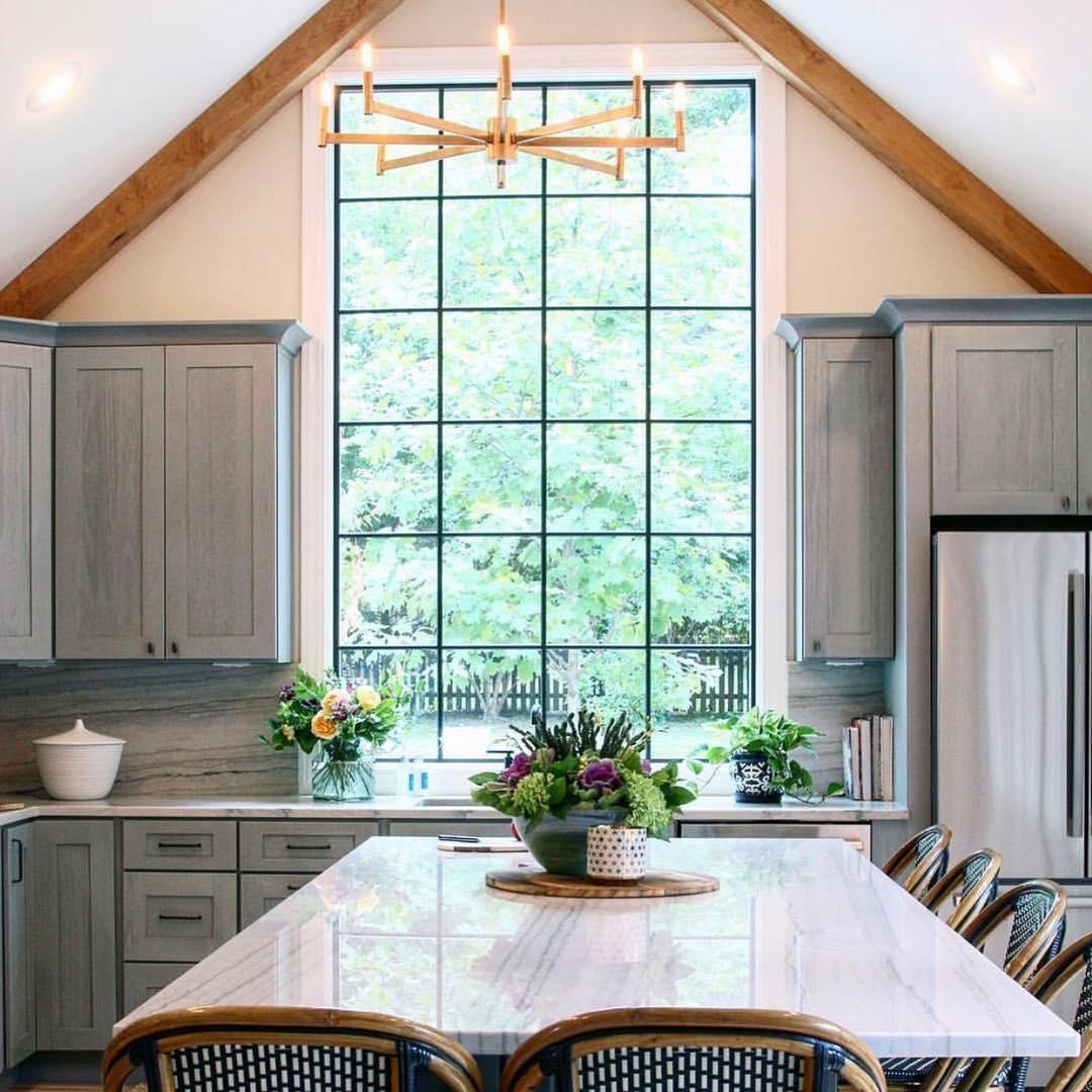 Natural light pouring in through large windows, brightening your farmhouse kitchen