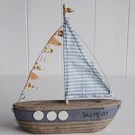 A small decorative wooden boat - The White Lighthouse | Boat decor .