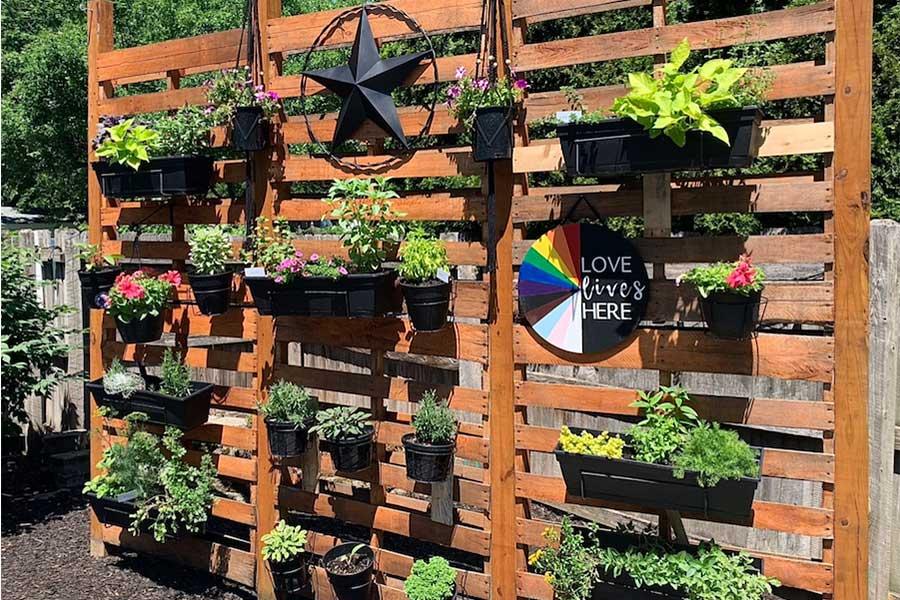 Introduce vertical space by attaching small pots to a Pallet Garden